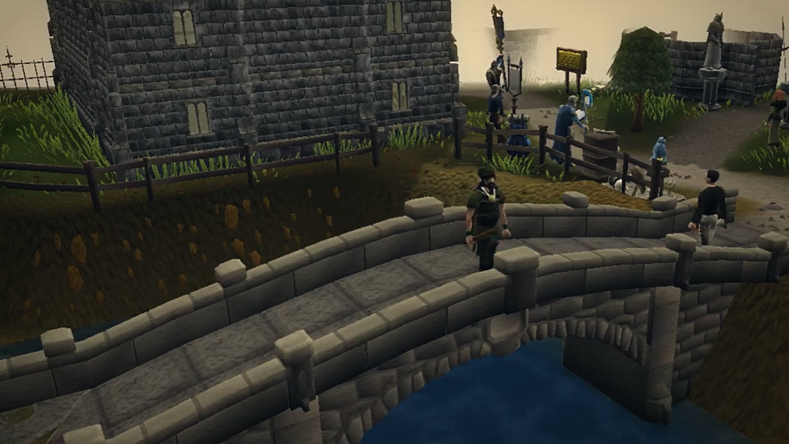 Players crossing a stone bridge by a castle wall